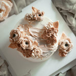 Buttercream flower cake in nude and beige colours.