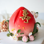 Red gradient ito pink 3D longevity peach shou tao cake with edible sugar plum blossoms and mini fondant peaches
