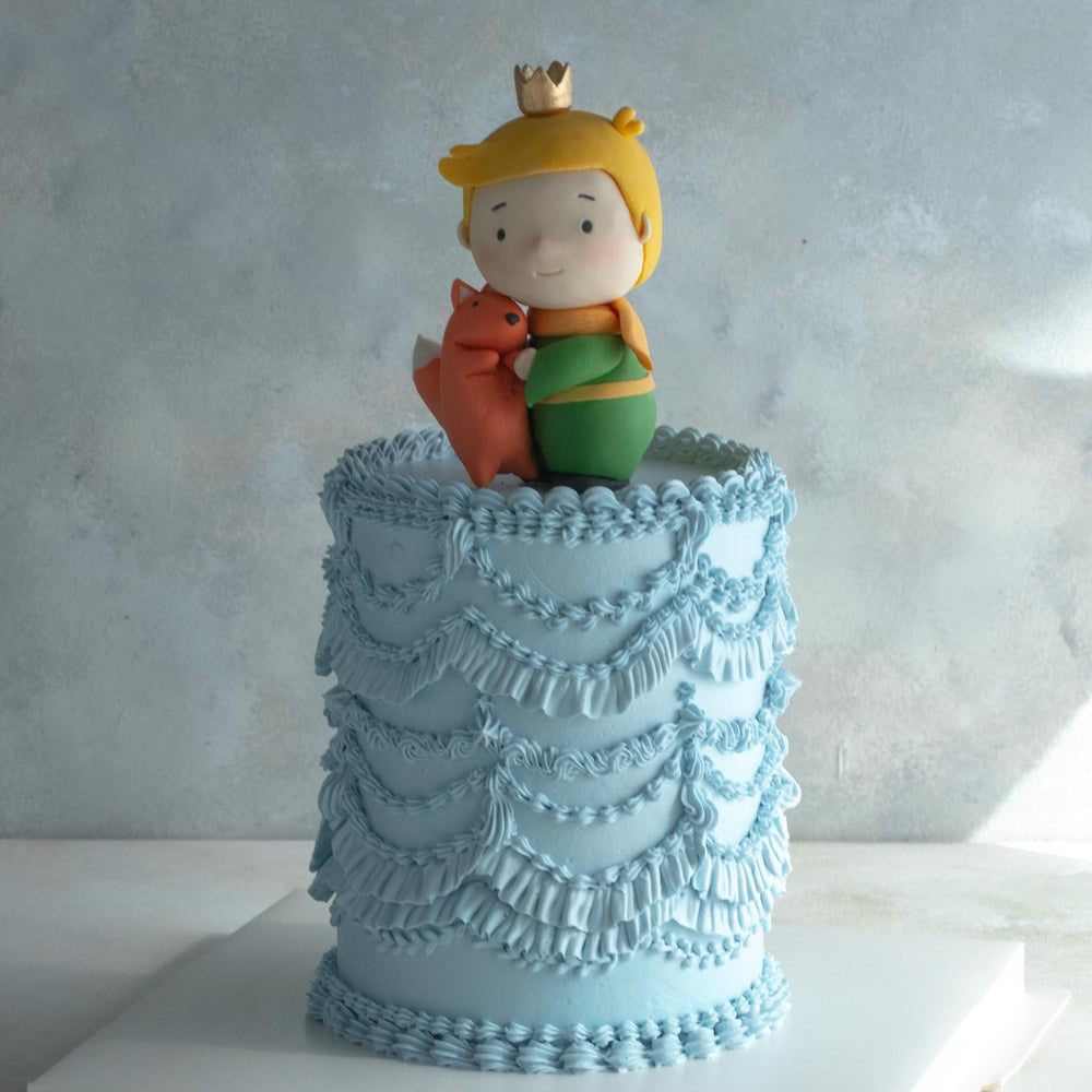 Dusty blue vintage buttercream cake for Singapore birthday parties, with a Little Prince fondant topper